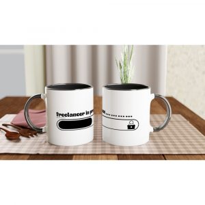 Freelancer in Progress statement in a white mug with black handle